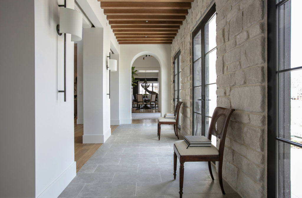 Hall by Studio Thomas.  Slate floors, stone walls, walnut ceiling, timeless interior design