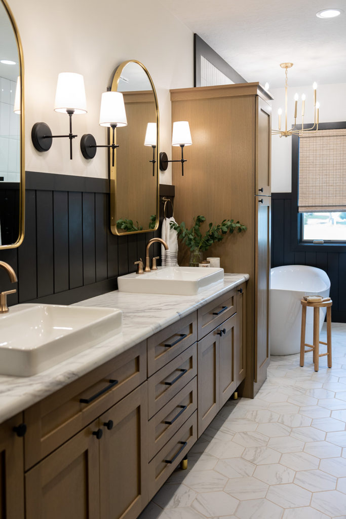Black & White Primary Bathroom Design with Brass Accents