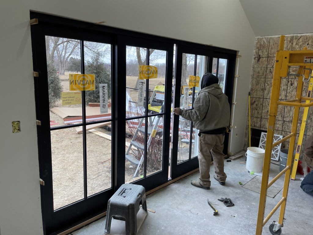 Man installing new Marvin Doors & Windows
